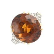 An 18ct gold citrine & diamond dress ring