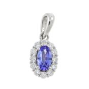 An 18ct gold tanzanite & diamond cluster pendant