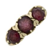 A 9ct gold garnet three-stone ring