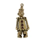 A mid 20th century 9ct gold gem-set articulated clown charm/pendant