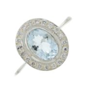 An aquamarine & diamond cluster ring