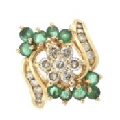An emerald & diamond floral cluster ring
