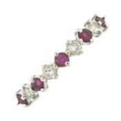 An 18ct gold ruby & diamond half eternity ring