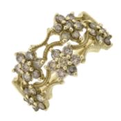 A 9ct gold diamond floral cluster band ring