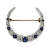 A 9ct gold sapphire and diamond crescent brooch