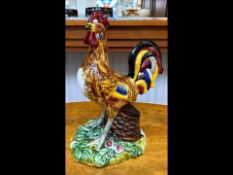 A Large Majestic Portugese Majolica Pottery Cockerel figure, decorated with vibrant plumage,