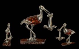 Novelty Silver and Amber Stork Carrying Baby. Hallmarked Silver and Amber Stork Carrying Baby.