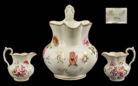 An unusual antique Derby or Rockingham floral decorated Masonic Jug,