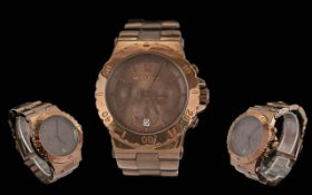 Michael Kors Wristwatch, with copper coloured bracelet strap, brown face with gold baton markers. In