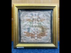 Antique Textile Fragment depicting stylised Griffins, framed and glazed. 10