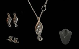 Two Welsh Gold Clogau Silver & Gold Pendant and Matching Earrings. In original boxes and bag.