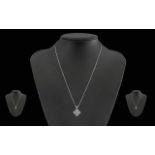 Ladies Pleasing 18ct White Gold Diamond Set Pendant Attached to a 18ct White Gold Chain.