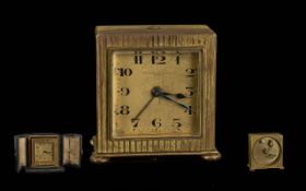1930's Metal-Dore Small Traveller's Clock, with alarm facility and folding display watch case.