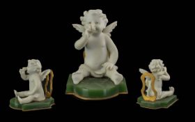 Boxed Set of Place Settings, cherub design.
