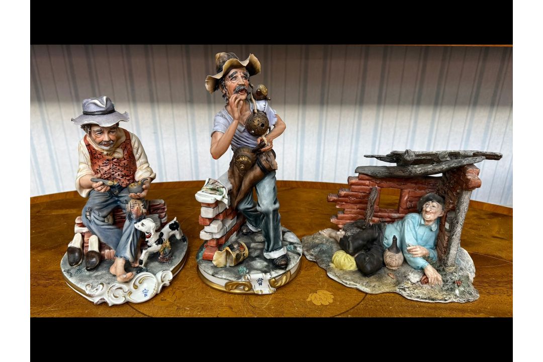 Three Capodimonte Figures, to include a drunk reclining, a tinker selling pots,