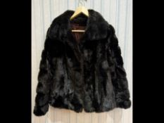 Ladies Astraka Black Faux Fur Jacket, fully lined in sateen fabric, hook and eye fastening,