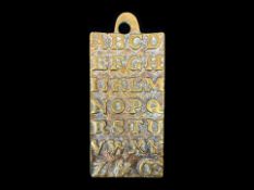 An Antique Brass Early 18th Century Child's Learning Alphabet Tablet,