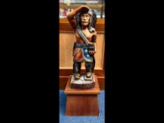 Large Wooden Advertising Figure, of a North American Indian, raised on a wooden base.