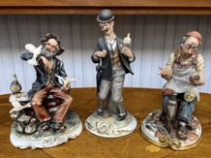 Three Capodimonte Figures, comprising a Shoemaker, and Drunk with Bottle, and Tramp feeding Doves.