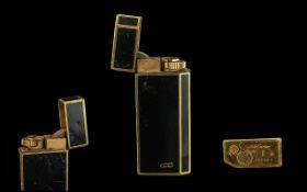 Must DE Cartier - Signed Gold Plated and Black Stylish Deluxe Lighter, Ref Number 88209. Good