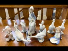 Box of Nao & Lladro, comprising five Nao swans, three Lladro swans, two Nao figures of children,
