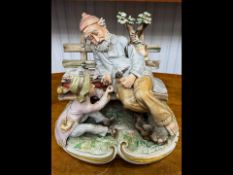 Large Capodimonte Figure of a Gentleman, on a park bench, with a child.