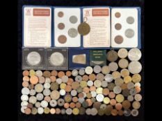 Tin Containing a Collection of Coins from around the world, some silver, Churchill Crowns, copper,