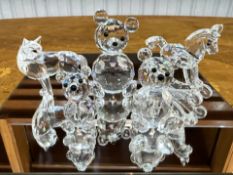 Three Swarovski Boxed Figures, to include a set of three Teddy Bears, a Wolf No. 207549, and a