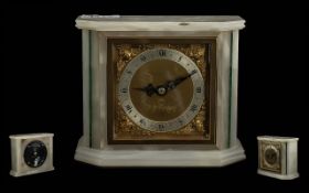 White Onyx Elliott Mantle Clock, silvered dial, Roman numerals, winged spandrels. Dial marked Mappin