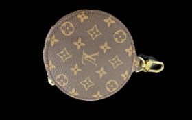 Genuine Louis Vuitton Round Coin Purse, with iconic monogram canvas with gold tone hardware.