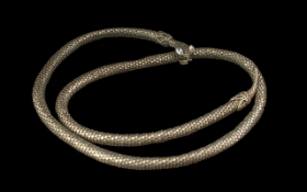 An Interesting Art Deco Period Silvered Metal Articulated Snake, its open jaw acts as a clip to hold