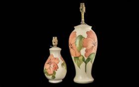 Moorcroft Hisbiscus Large Table Lamp Base 17'' high, together with a matching lamp base 11'' high.