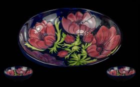 Moorcroft Large Handpainted Tube Lined Footed Bowl - Clematis Design On Blue Ground. Circa 1994.