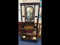 Oak Coat Stand, central mirror with coat hooks to either side, above a single drawer, with two
