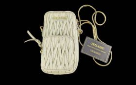 Genuine Miu Miu Matelasse Nappa Cream Leather Bag, with a distinctive matelasse quilted three