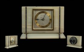 White Onyx Elliott Mantle Clock, gilt dial, Roman numerals, with two marbled inlaid vertical bands