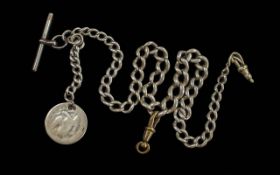 A Sterling Silver Albert Chain with T-Bar, Key and Coin. Marked Silver. Weight 43.3 grams. Length 16