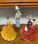 Three Figures, to include Royal Doulton 'Topaz Birthstone' HN5636, Royal Doulton 'Autumn Breezes'