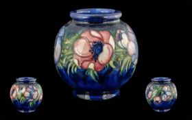 William Moorcroft Signed Globular Shaped Vase ' Anemone ' Design on Blue Ground. c.1940. Height 6.25