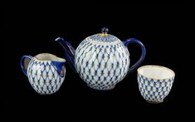Decorative Russian Tea Pot, Milk Jug and Sugar Bowl, in lovely blue and gilt pattern on white
