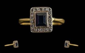 Ladies 18ct Gold Sapphire and Diamond Set Ring. Tests 18ct. The Central Step-cut Sapphire of