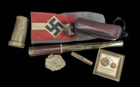Small Collection of Militaria, to include an East German NVA cap with badge, a swastika armband,
