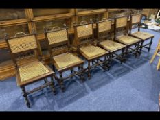 Set of Six Dining Chairs, rush seats and backs with carved lion head tops, brass handles, turned oak