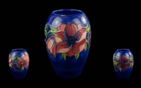 Walter Moorcroft Tube Lined Handpainted Ovoid Shaped Vase - Anemone Design On Blue Ground. Circa