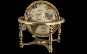 Gem Set Globe, cream with coloured gems, on a brass frame. Measures approx. 15'' high.