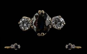 Ladies 18ct Gold 3 Stone Sapphire and Diamond Set Ring. Marked 18ct to Shank. The Central Sapphire