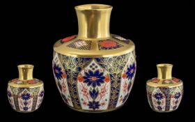 Royal Crown Derby Vase in the traditional Old Imari pattern 1128, in baluster shape with embellished