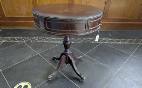Mahogany Regency Style Drum Table, with central pedestal base with four splayed legs and claw feet