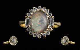 Ladies Pleasing 18ct Gold Diamond and Opal Set Ring. Marked 18ct to Shank. The Central Opal of