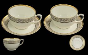 Cartier Boxed Set of Two Cups & Saucers, La Maison Des Must, marked Cartier. White with gilt trim,